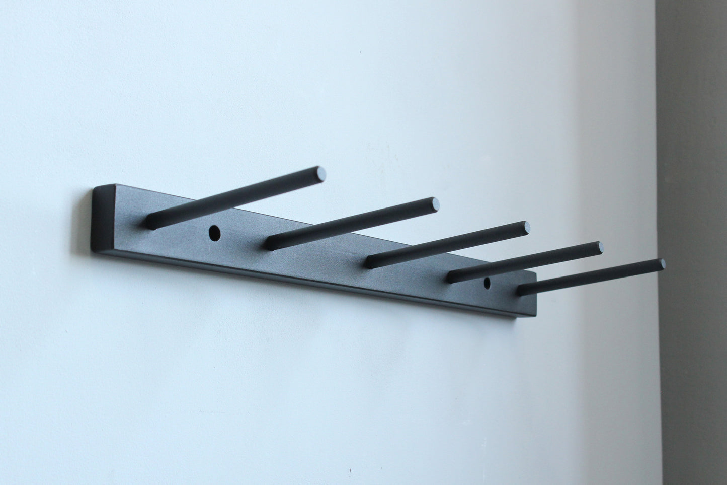 Metal wall-mounted boot hanger