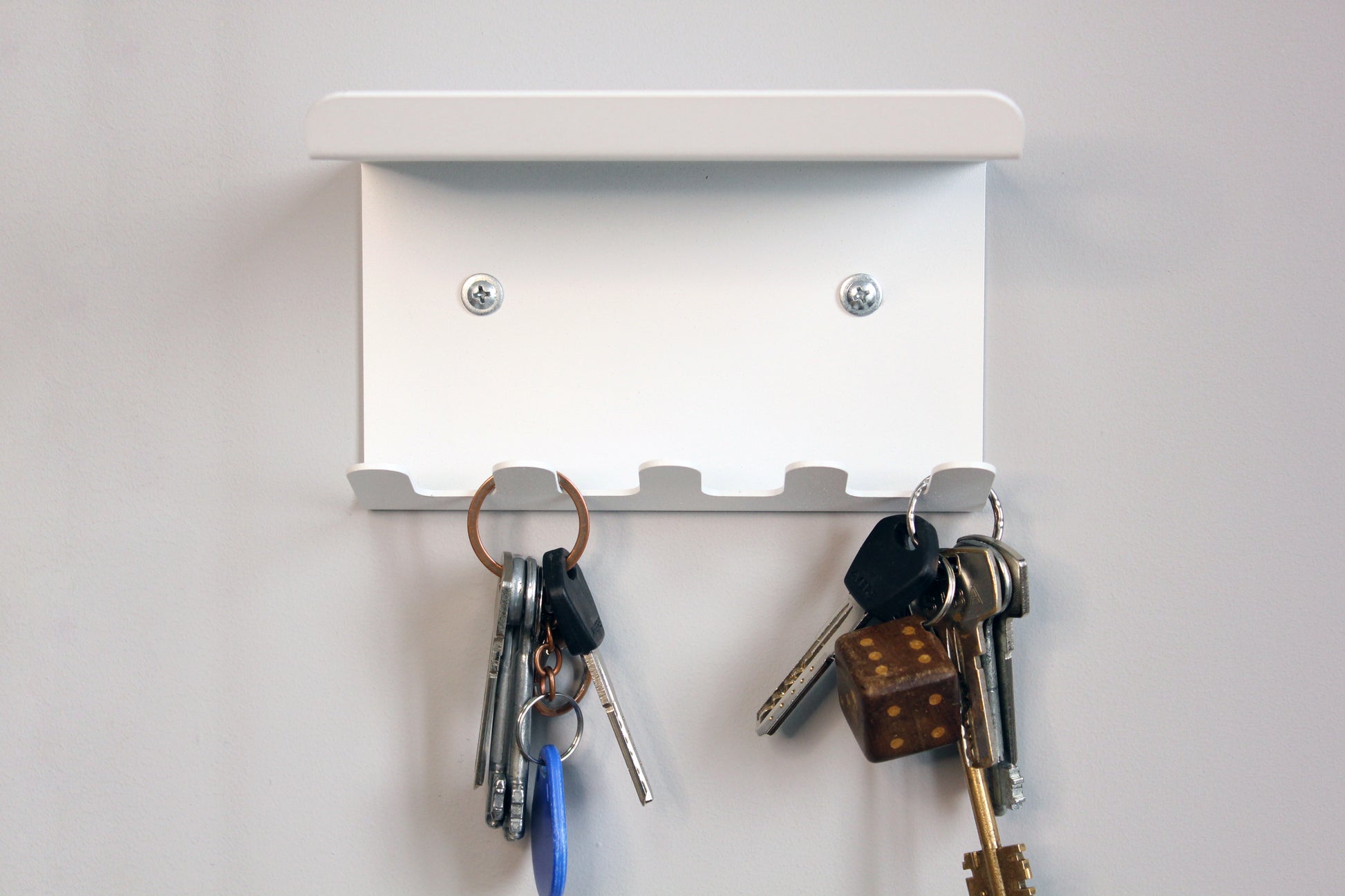 metal shelf with key hooks